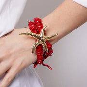 Bracciale in Metallo con pietre rosse e stella marina con rifinitura martellata