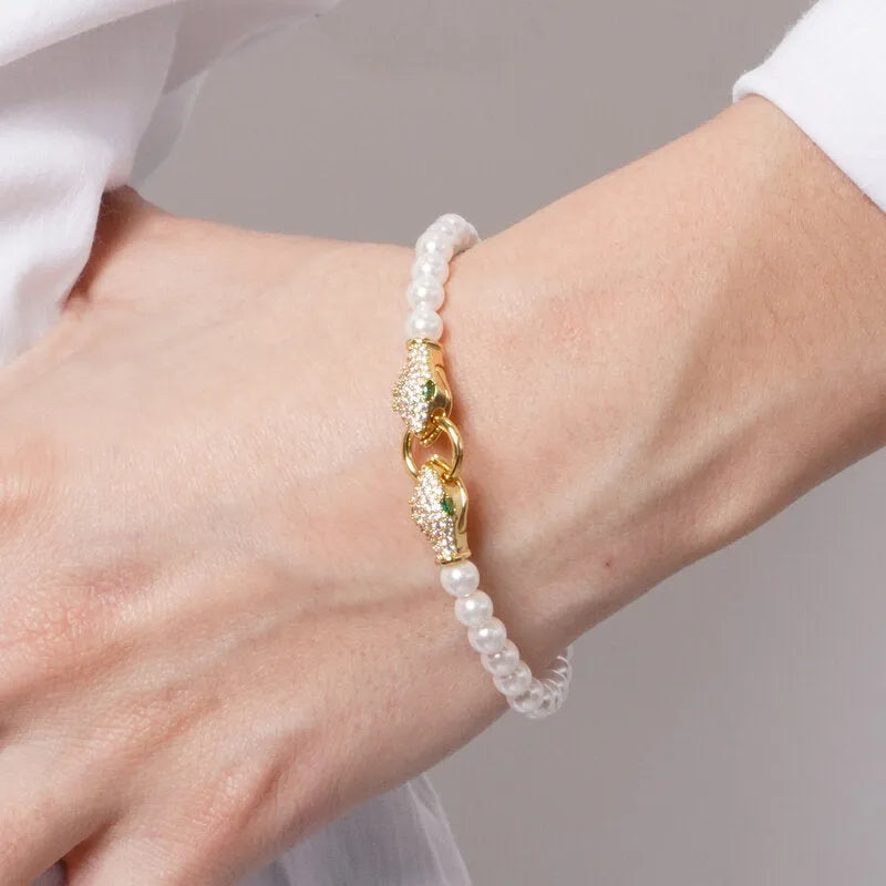 Bracciale in Metallo donna in metallo con sfere satinate e chiusura a forma di serpente dorato con cristalli luminosi,