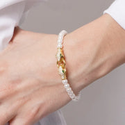 Bracciale in Metallo donna in metallo con sfere satinate e chiusura a forma di serpente dorato con cristalli luminosi,