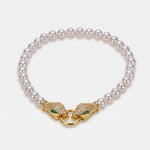 Bracciale in Metallo donna in metallo con sfere satinate e chiusura a forma di serpente dorato con cristalli luminosi, - BYSIMON gioielli
