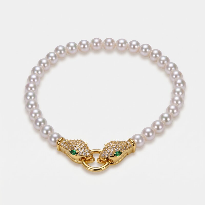 Bracciale in Metallo donna in metallo con sfere satinate e chiusura a forma di serpente dorato con cristalli luminosi, - BYSIMON gioielli