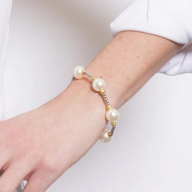 Bracciale in Metallo elastico sfere avorio dorate