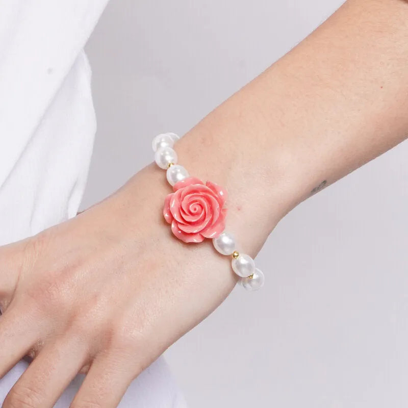 Metal bracelet with coral flower and pearls