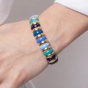 Elastic metal bracelet with blue-toned links