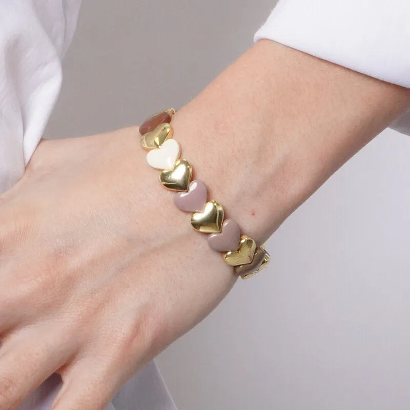 Bracciale in Metallo elastico con maglie a forma di cuore sui toni caldi