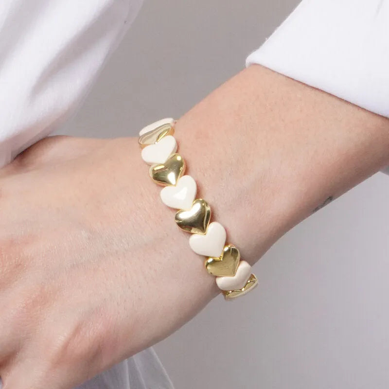 Bracciale in Metallo elastico con maglie a forma di cuore bianche e oro