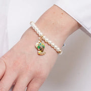 Bracciale in Metallo elastico sfere bianche e testa di moro