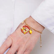 Bracciale in Metallo con ciondoli pendenti ruota rossa, limone e margherita