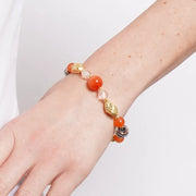 Bracciale in Metallo elastico con Vetro Murano pietre arancioni, dorate e nere