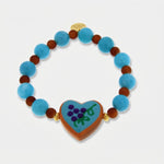 Bracciale in Metallo elastico con cuore turchese e perle rosse e azzurre - BYSIMON gioielli
