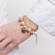 Bracciale in Metallo sfere bianche campanelle multicolor