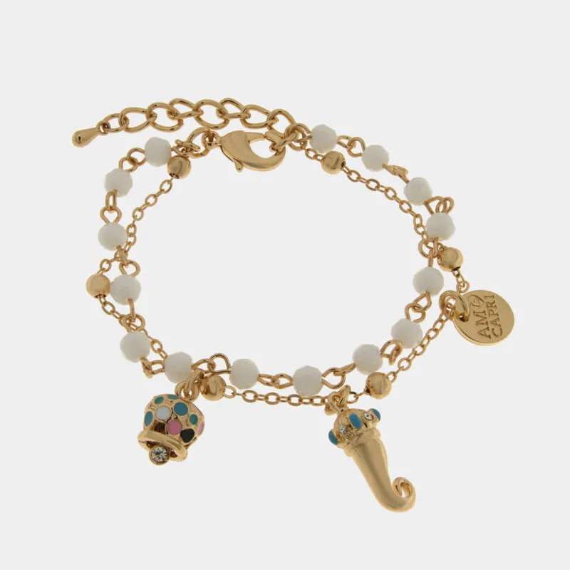 Bracciale in Metallo multifilo con sfere bianche, corno dorato con dettagli azzurri e campanella multicolore