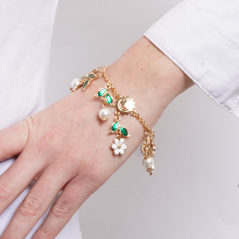 Bracciale in Metallo catena dorata sole fiori bianchi foglie verdi perle charm Capri