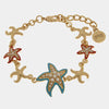 Bracciale in Metallo con stelle marine smaltate e pietre bianche
