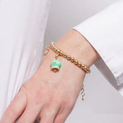 Bracciale in Metallo con campanella portafortuna verde menta e cristalli