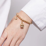 Bracciale in Metallo con campanella portafortuna dorata e cristalli