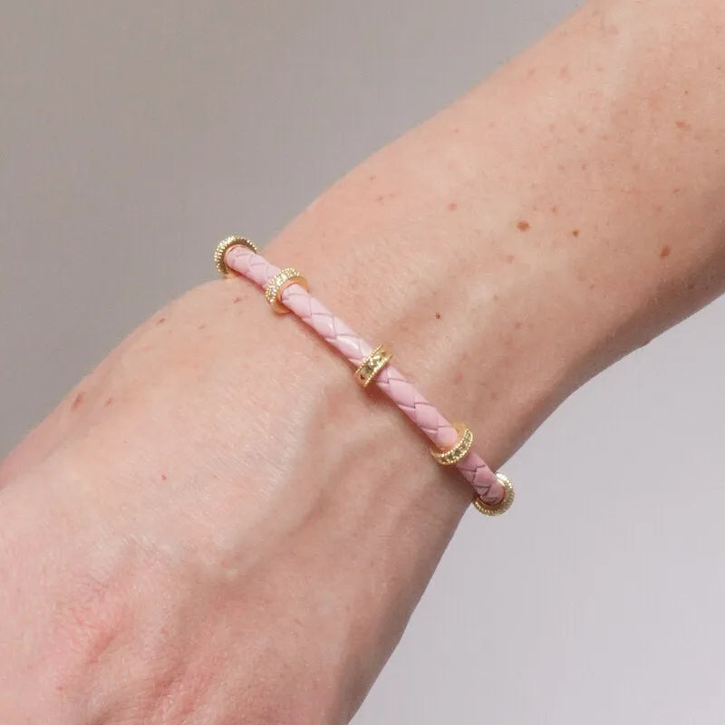 Bracciale in Metallo semirigido in simil pelle intrecciata rosa