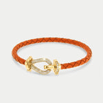 Bracciale in Metallo simil pelle intrecciata arancione con chiusura gioiello dorata - BYSIMON gioielli