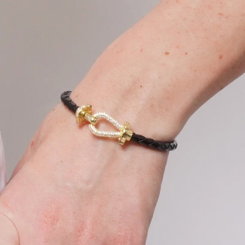 Bracciale in Metallo simil pelle intrecciata nero con chiusura gioiello dorata