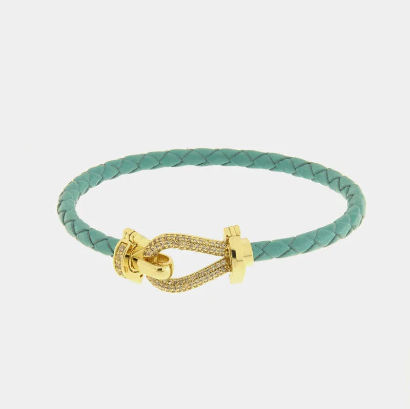 Bracciale in Metallo simil pelle intrecciata turchese con chiusura gioiello dorata