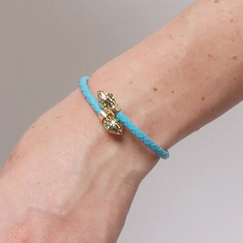 Bracciale in Metallo simil pelle intrecciata turchese con chiusura serpenti dorati