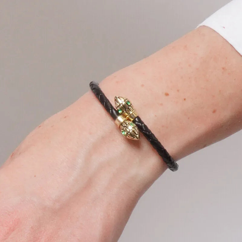 Bracciale in Metallo simil pelle intrecciata nero con chiusura serpenti dorati