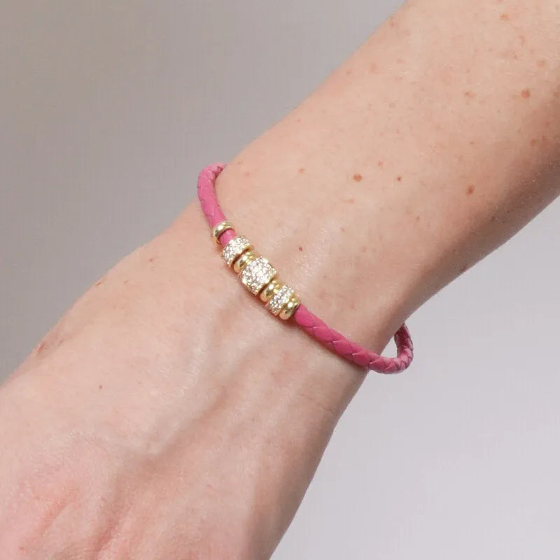 Bracciale in Metallo semirigido in simil pelle intrecciata rosa dettagli dorati centrali
