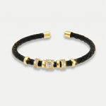 Bracciale in Metallo semirigido in simil pelle intrecciata nero dettagli dorati centrali - BYSIMON gioielli