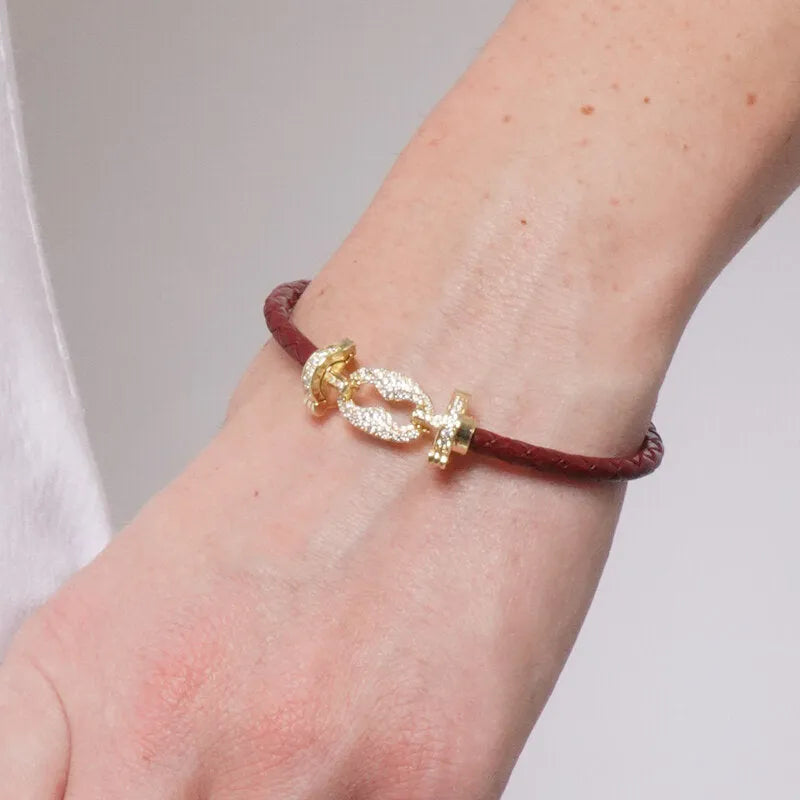 Bracciale in Metallo simil pelle intrecciata marrone con chiusura gioiello dorata