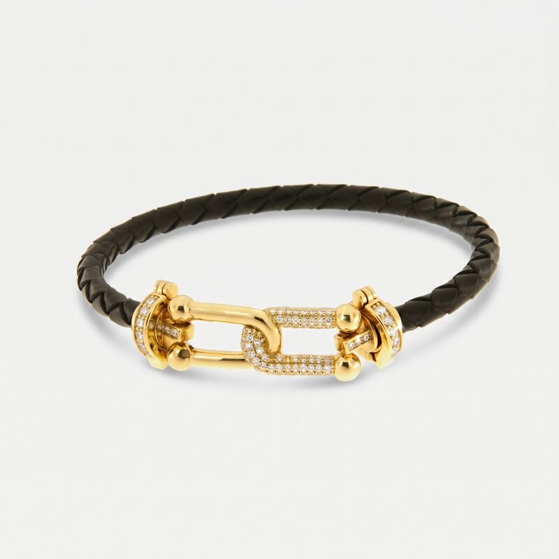Bracciale in Metallo simil pelle intrecciata nero con chiusura gioiello dorata - BYSIMON gioielli