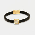 Bracciale in Metallo simil pelle intrecciata nero con centrale quadrato dorato - BYSIMON gioielli