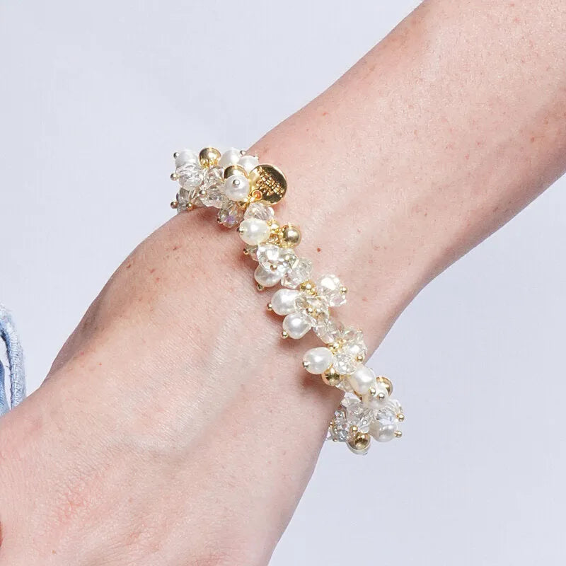Bracciale in Metallo elastico con perline bianche