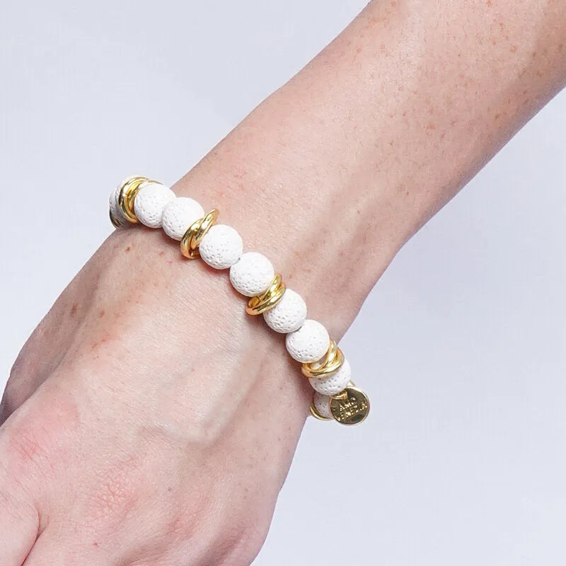 Bracciale in Metallo elastico con sfere laviche bianche