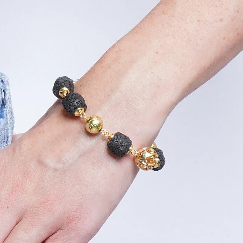 Bracciale in Metallo con sfere dorate e pietre laviche