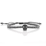 Bracciale in Acciaio cordino cerato nero con teschio e cristalli neri. Chiusura regolabile.