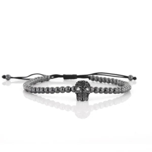 Bracciale in Acciaio cordino cerato nero con teschio e cristalli neri. Chiusura regolabile.