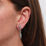 Orecchini in Acciaio con campanelle portafortuna, impreziosite da punto luce