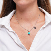 Collana in Acciaio con campanella verde acqua, impreziosita da punto luce