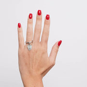 Anello in Acciaio con campanella portafortuna impreziosita da punto luce