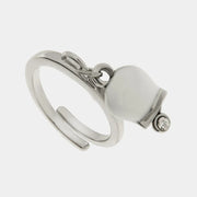 Anello in Acciaio con campanella portafortuna bianca e punto luce