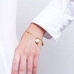 Bracciale in Acciaio campanella portafortuna bianca e oro - BYSIMON gioielli