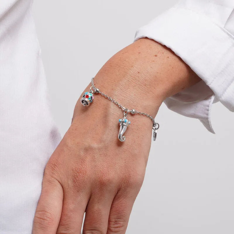 Bracciale in Acciaio con corno impreziosito da punte di smalto turchese e campanella in smalti multicolore - BYSIMON gioielli