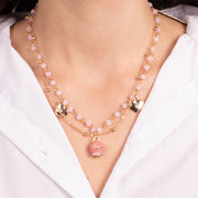 Metal necklace with pink enamelled bell and hanging hearts