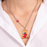Metal necklace with orange teddy bear and red heart