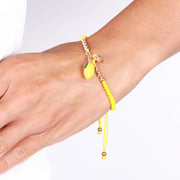Metal bracelet with lemon and yellow cord