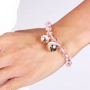 Metal bracelet with rattles and pink stones