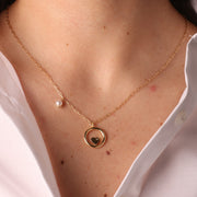Collana in Argento 925 con dettaglio in perla e pendente a forma di cerchio con cuore