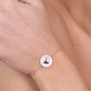 Bracciale in Argento 925  rosè con cuore su base madre perla in giro di zirconi
