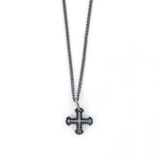 Collana in Acciaio con pendente raffigurante una croce greca impreziosita da cristalli neri.