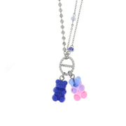 Multi-strand steel necklace with hanging teddy bears